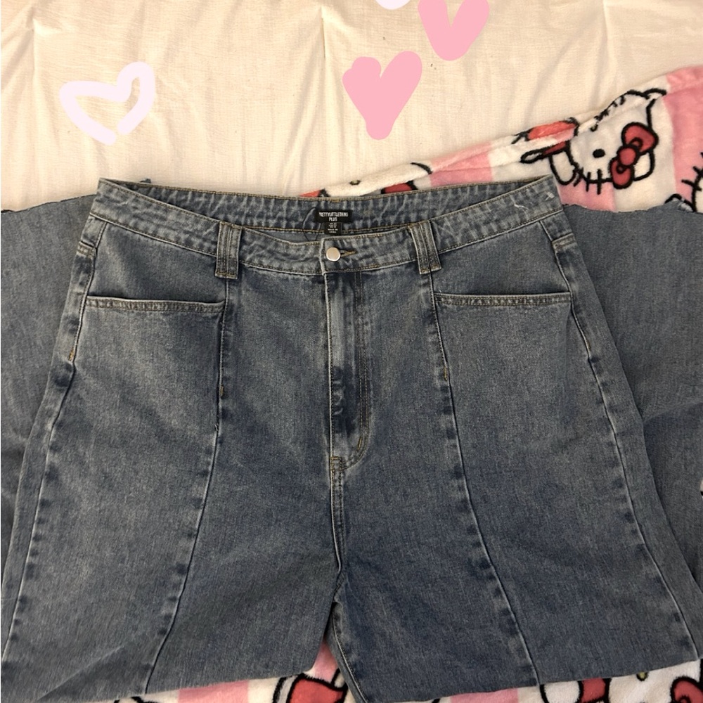 High waisted blue mom jeans , cut at the bottom. Very “wide-legged”
